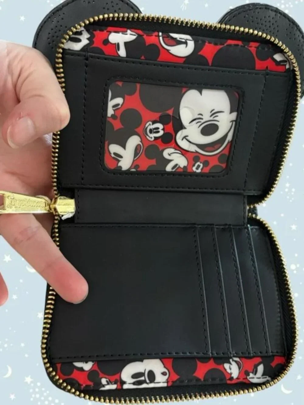 Disney Loungefly black Mickey Mouse wallet with punch Mickey heads design